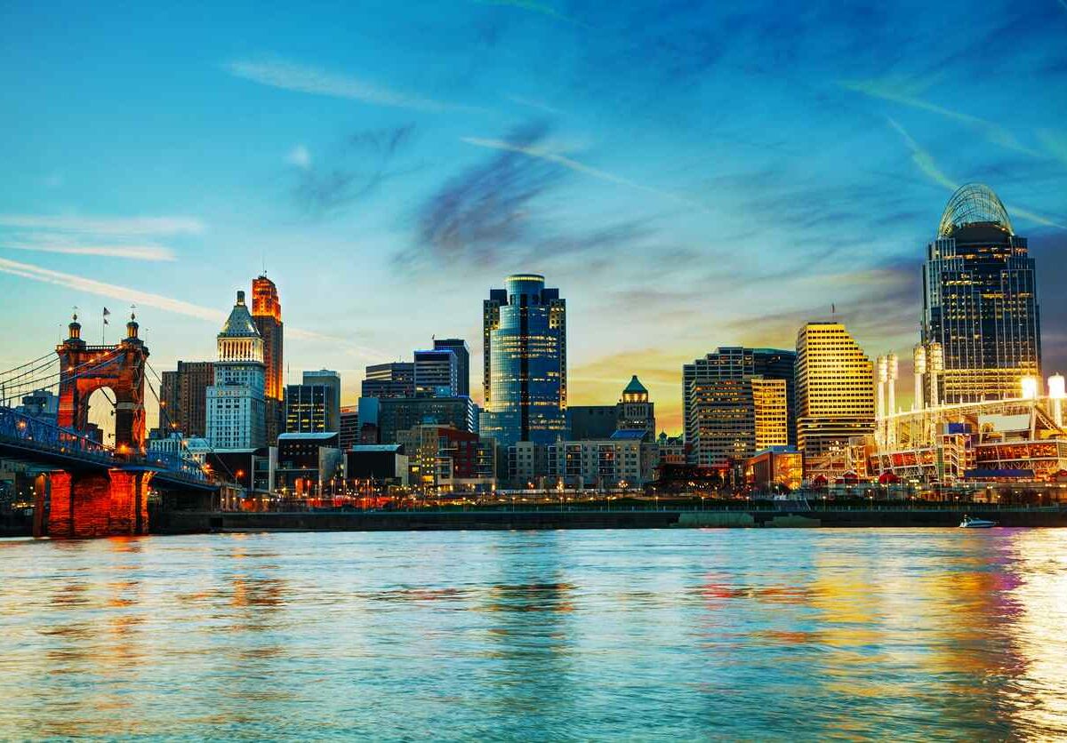 a view of the downtown cincinnati skyline at dusk