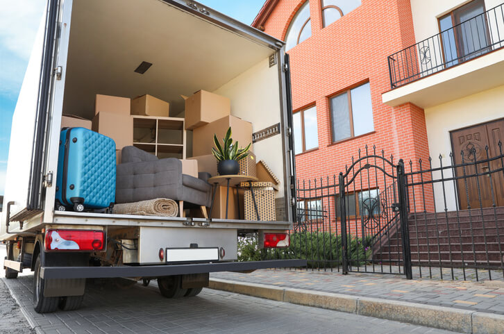 Back of a truck packed up waiting on the curb