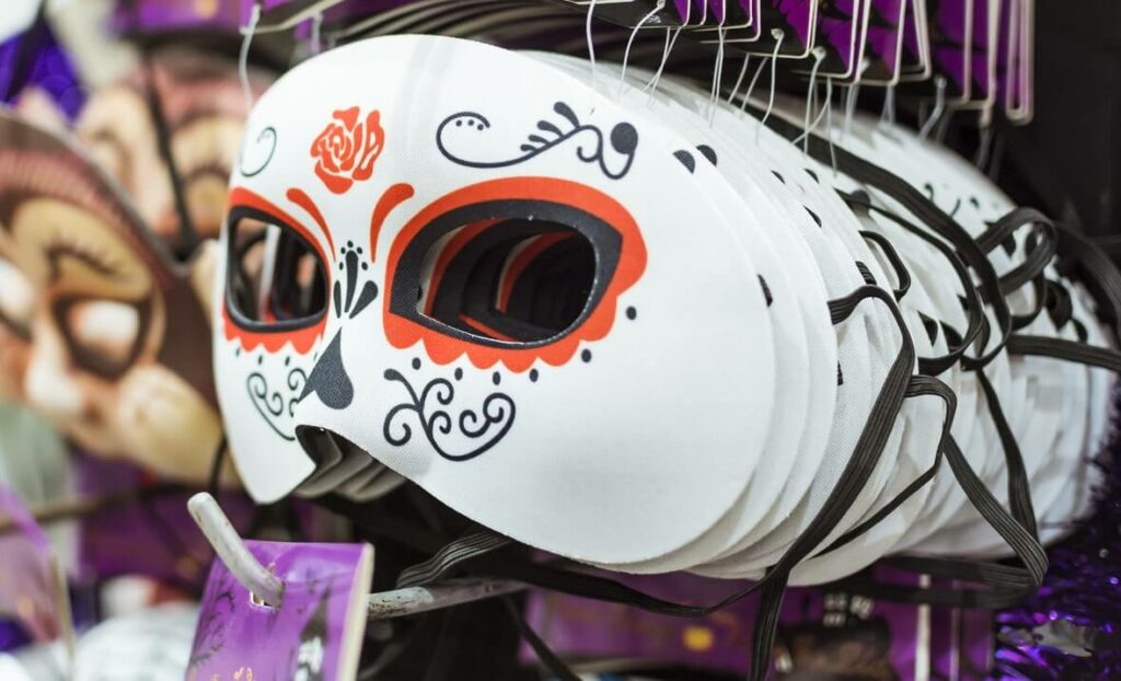 Day of the Dead masks for sale at a costume shop.